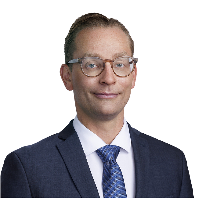 Dr. Wade T. Iams wearing a suit and tie.